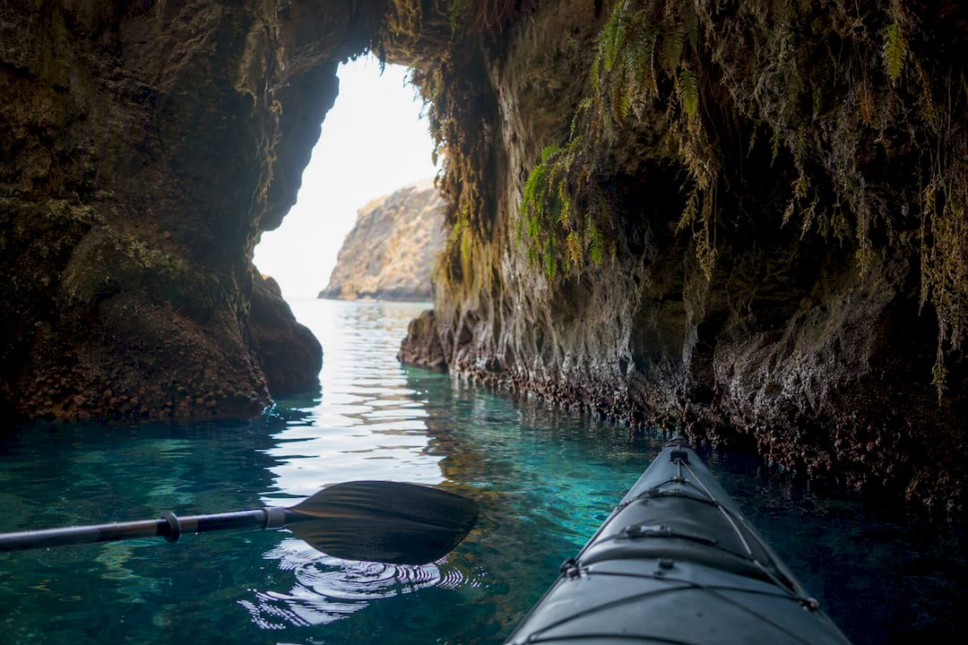 Kayak paddle near sea cave entrance on Santa Cruz Island