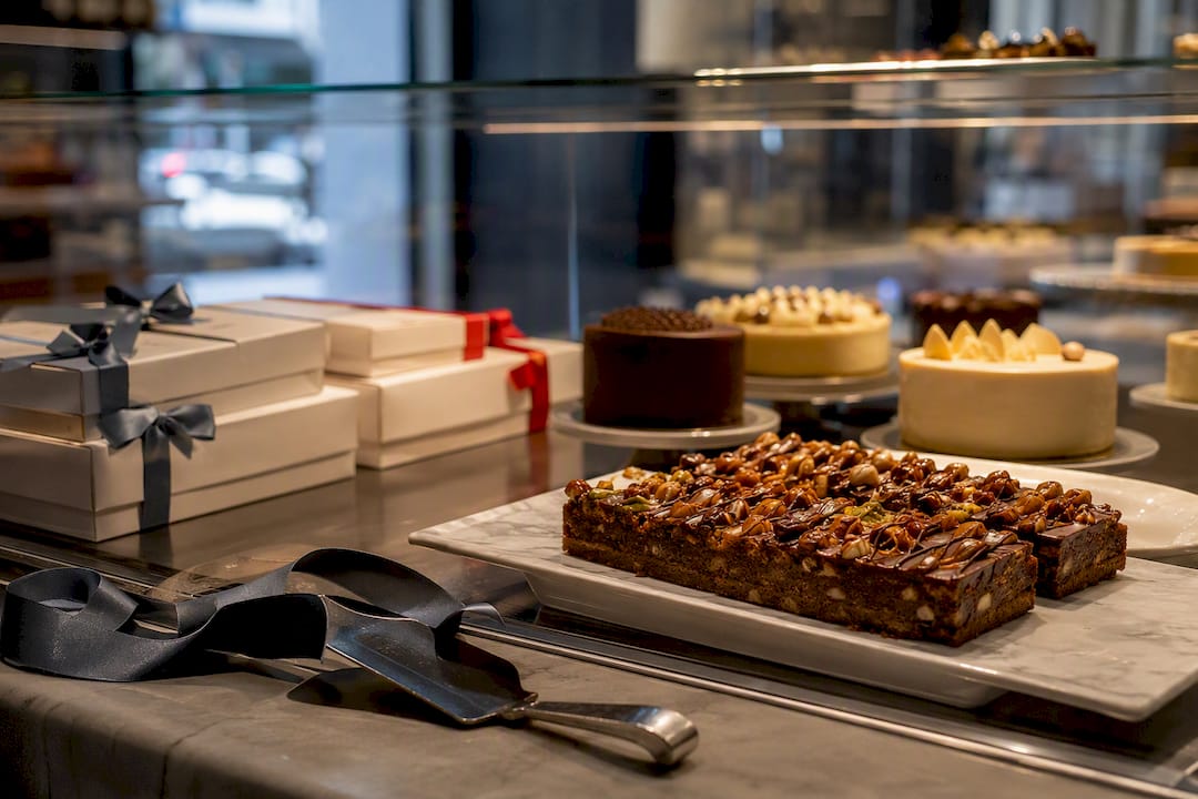 Specialty desserts arranged in bakery display case