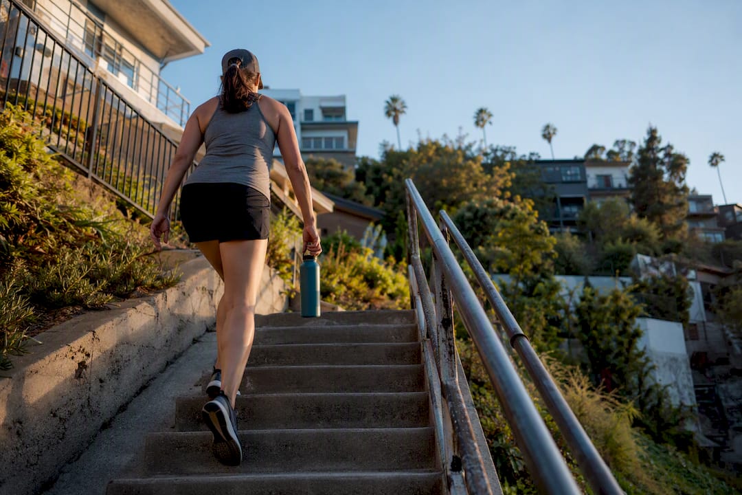 Walker ascending historic Los Angeles hillside stairs