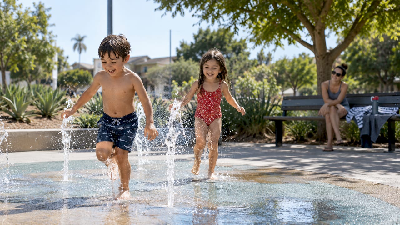 Children playing at neighborhood splash pad