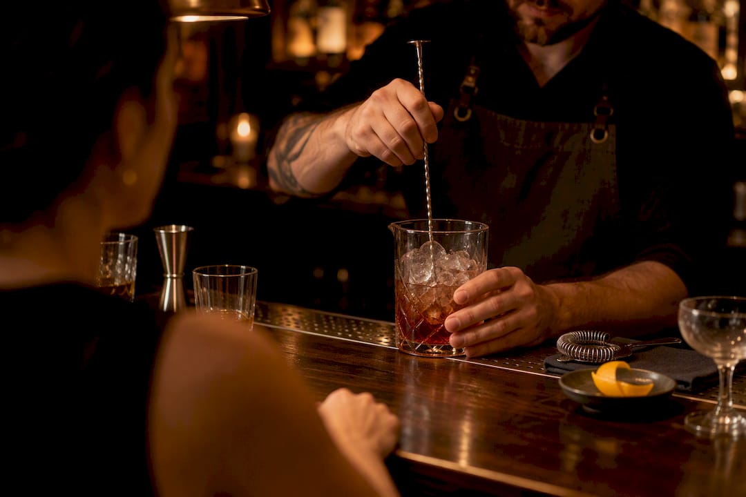 Bartender preparing a personalized craft cocktail