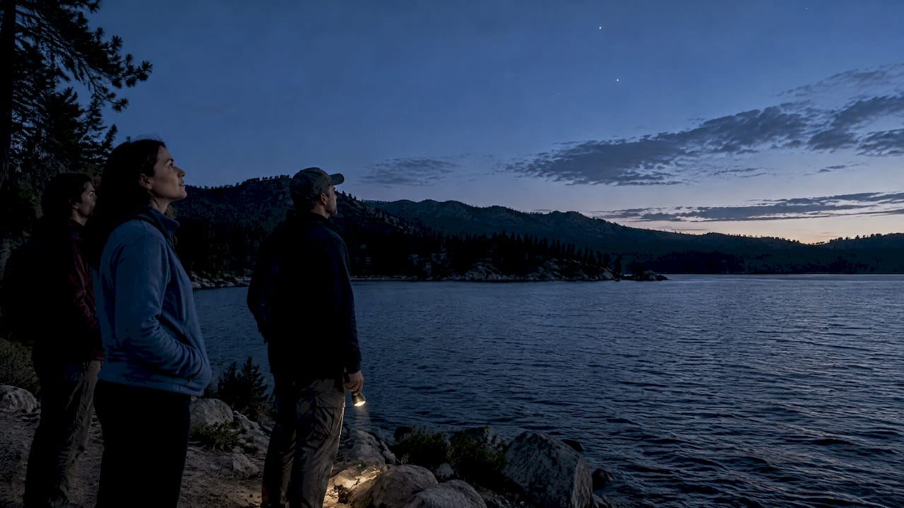Visitors stargazing beside Big Bear Lake