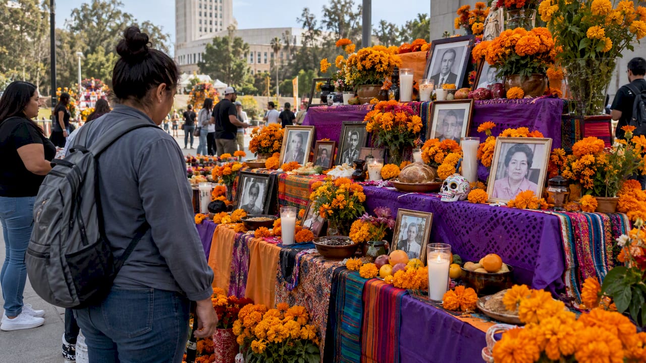 Tiered community ofrenda with marigolds and offerings